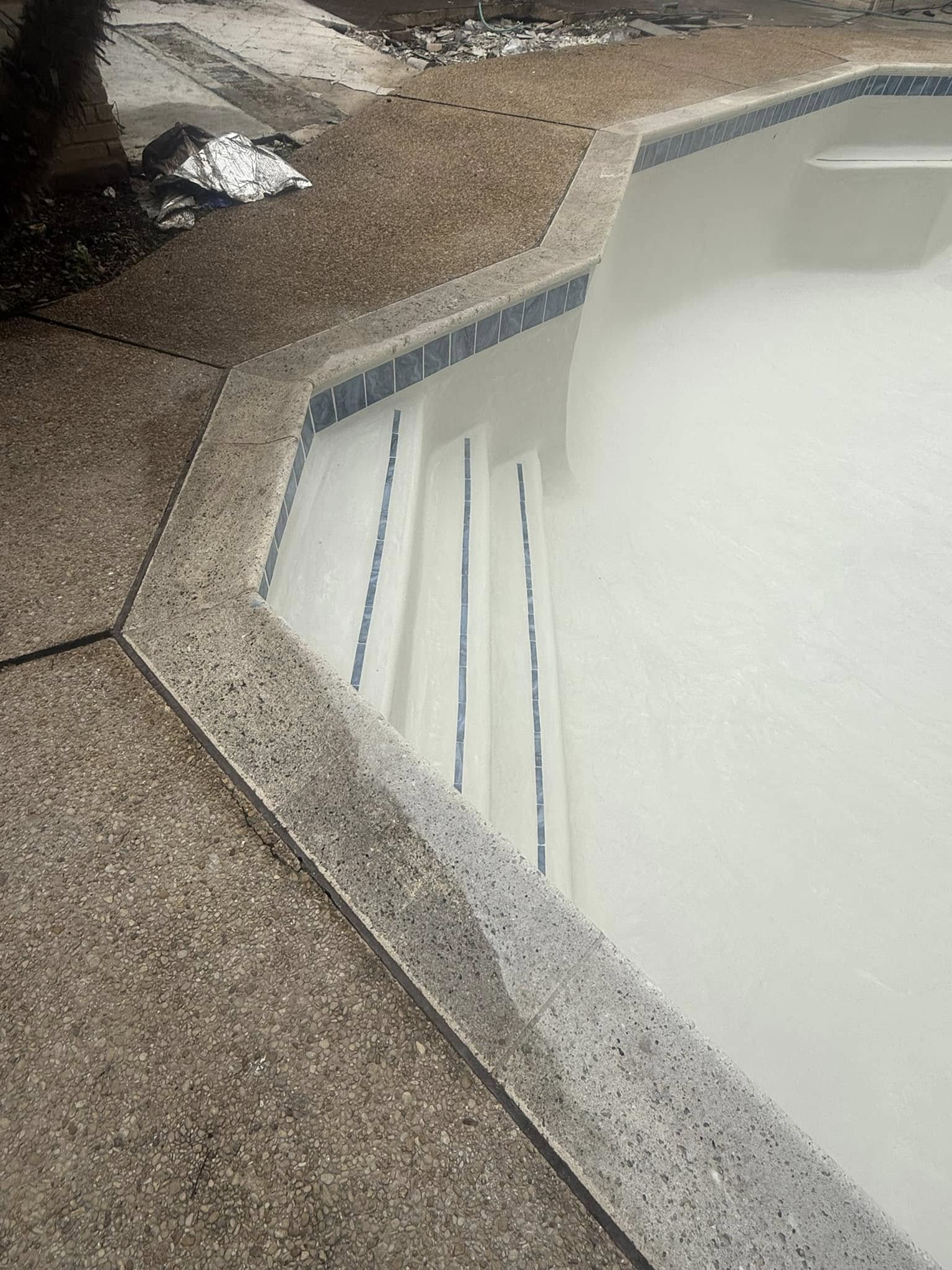 Fresh plaster detail with blue tile