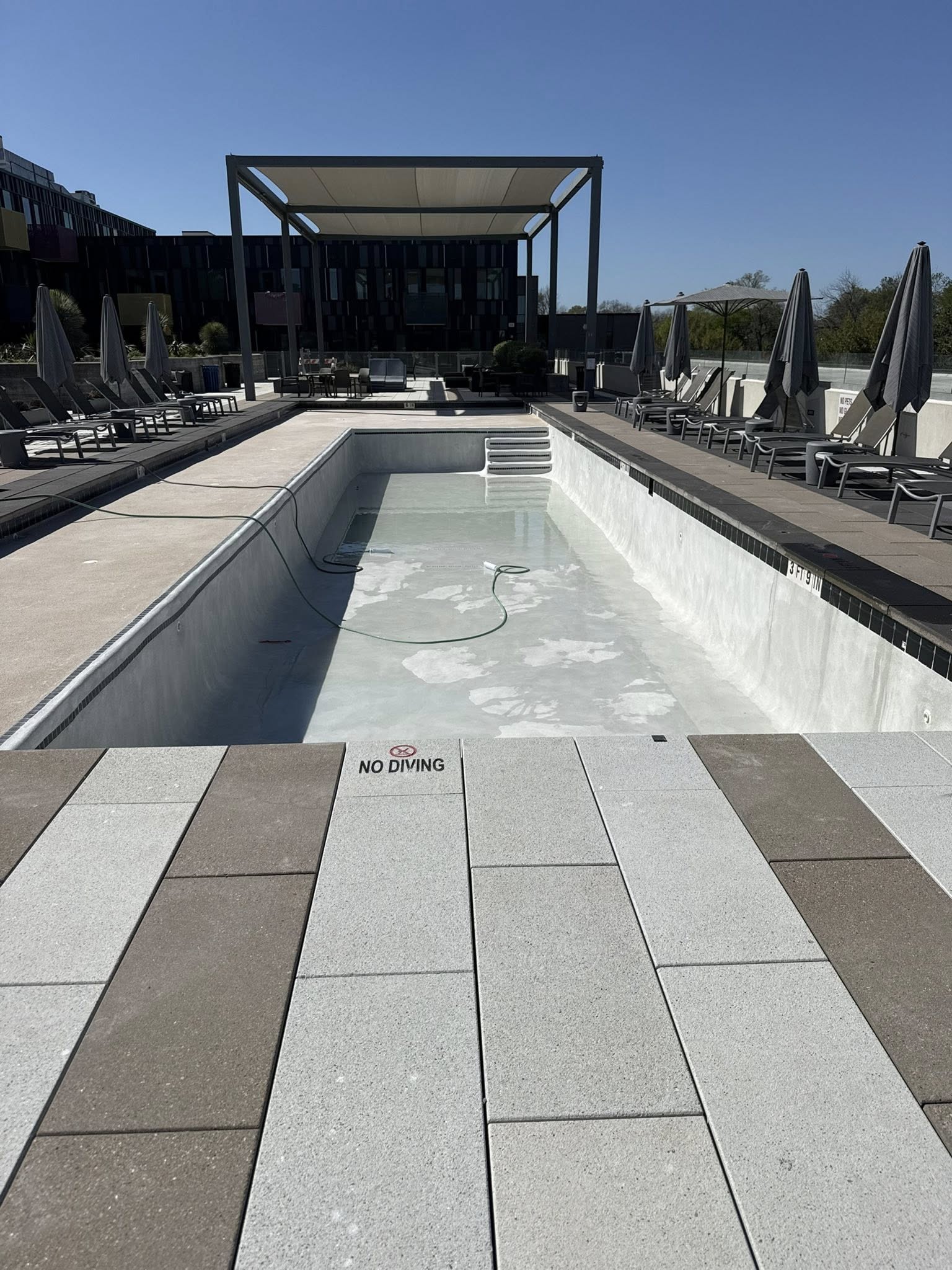 Commercial pool before resurfacing